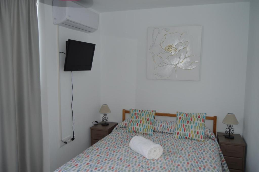 Posteľ alebo postele v izbe v ubytovaní La Casita Morada