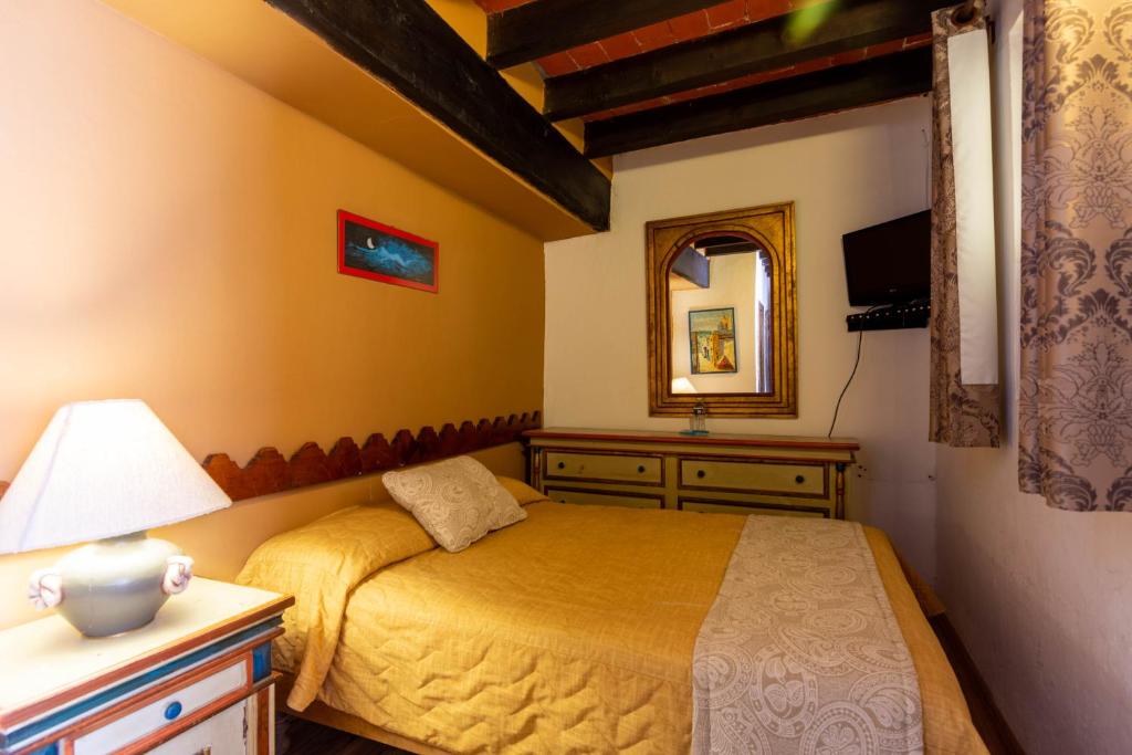 Postel nebo postele na pokoji v ubytování Hosteria del Frayle