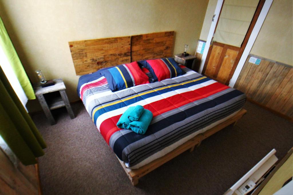 Postel nebo postele na pokoji v ubytování Corner Hostel Puerto Natales