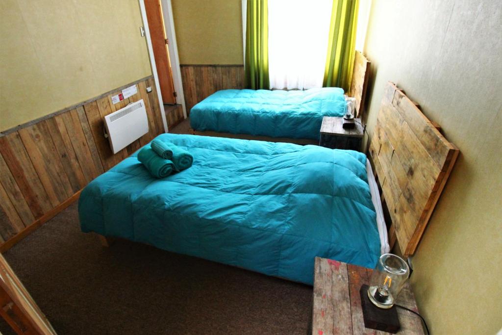 Postel nebo postele na pokoji v ubytování Corner Hostel Puerto Natales
