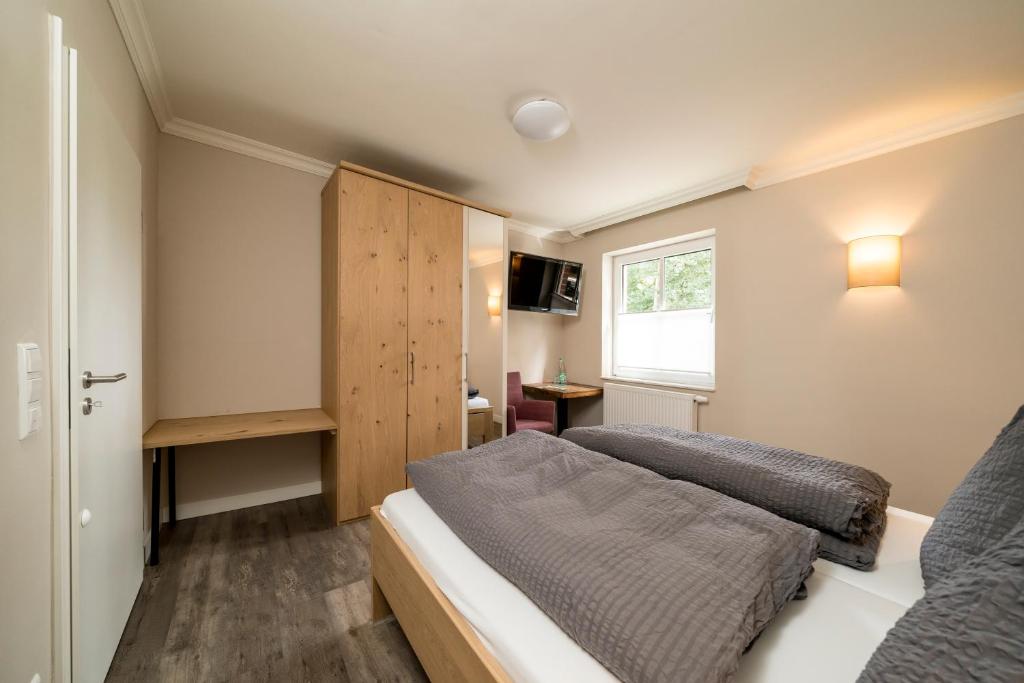 Postel nebo postele na pokoji v ubytování Haus am Parc