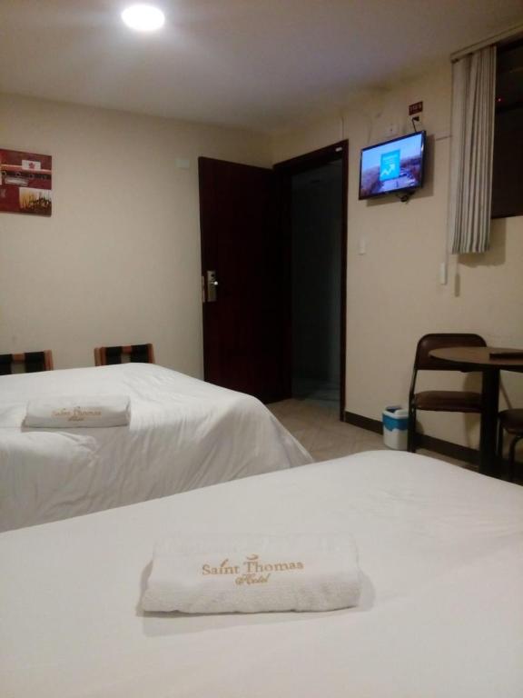 Postel nebo postele na pokoji v ubytování Hotel Saint Thomas