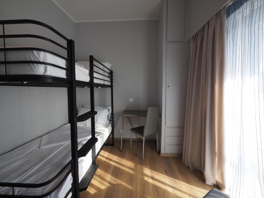A bed or beds in a room at Sophia's Penthouse Apartment With Jacuzzi and Acropolis View From Big Terrace