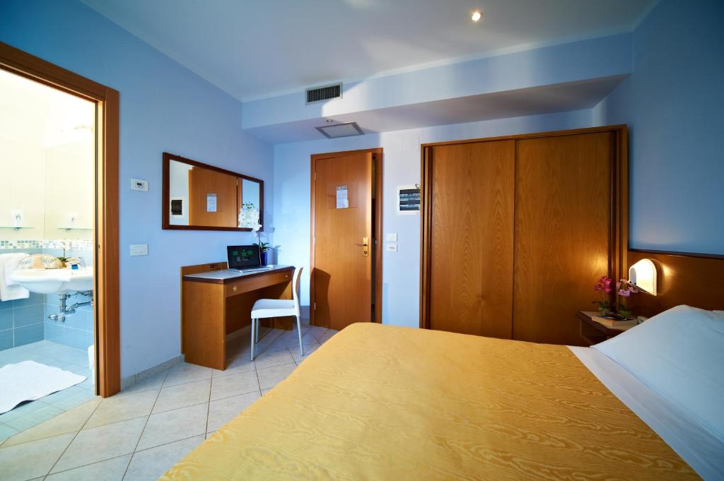 Postel nebo postele na pokoji v ubytování Hotel Sirio