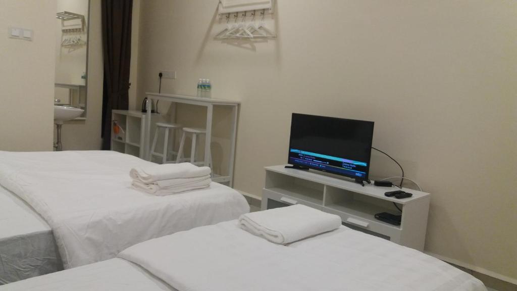 Postel nebo postele na pokoji v ubytování GLG KLIA Transit House
