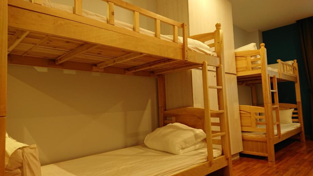 Postel nebo postele na pokoji v ubytování Austin Park Hotel