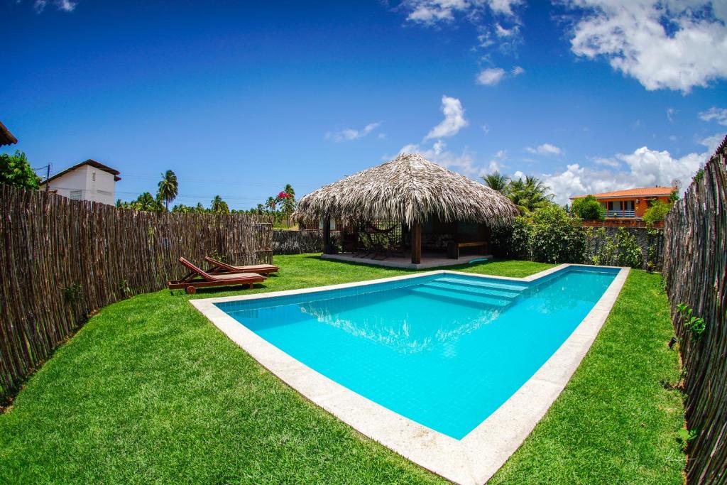 a swimming pool in the yard of a villa at Toca do Caranguejo in Pôrto de Pedras