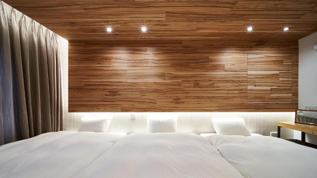 Postel nebo postele na pokoji v ubytování Carta Hotel Kyoto Bettei