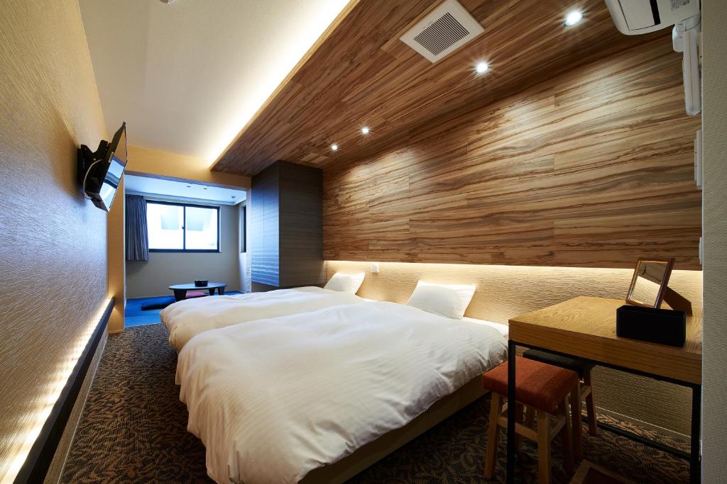 Postel nebo postele na pokoji v ubytování Carta Hotel Kyoto Bettei
