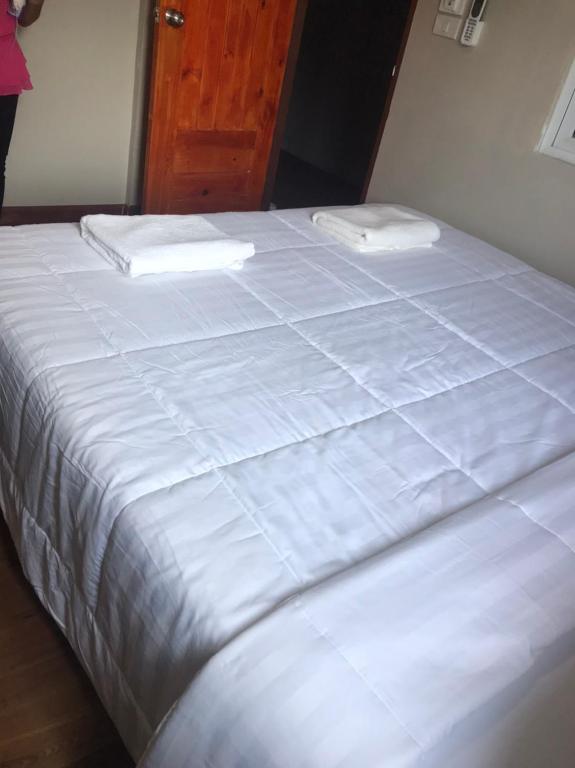 Postel nebo postele na pokoji v ubytování Aladdin Guest House