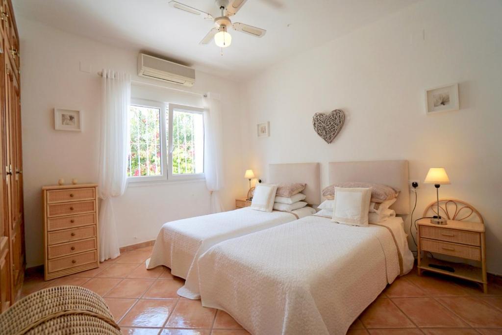 A bed or beds in a room at Lara