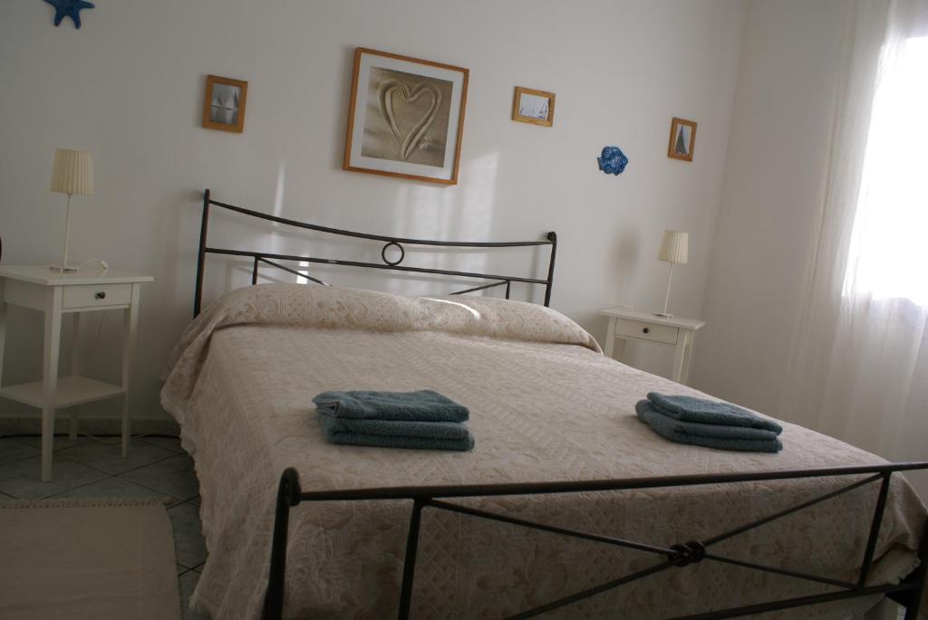 Postel nebo postele na pokoji v ubytování I Ginepri B&B