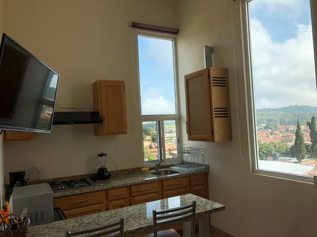 Kuchyň nebo kuchyňský kout v ubytování CHIFLON VILLAS