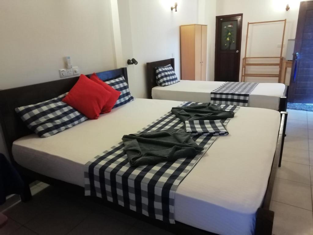 Ένα ή περισσότερα κρεβάτια σε δωμάτιο στο Hotel Universal Beach