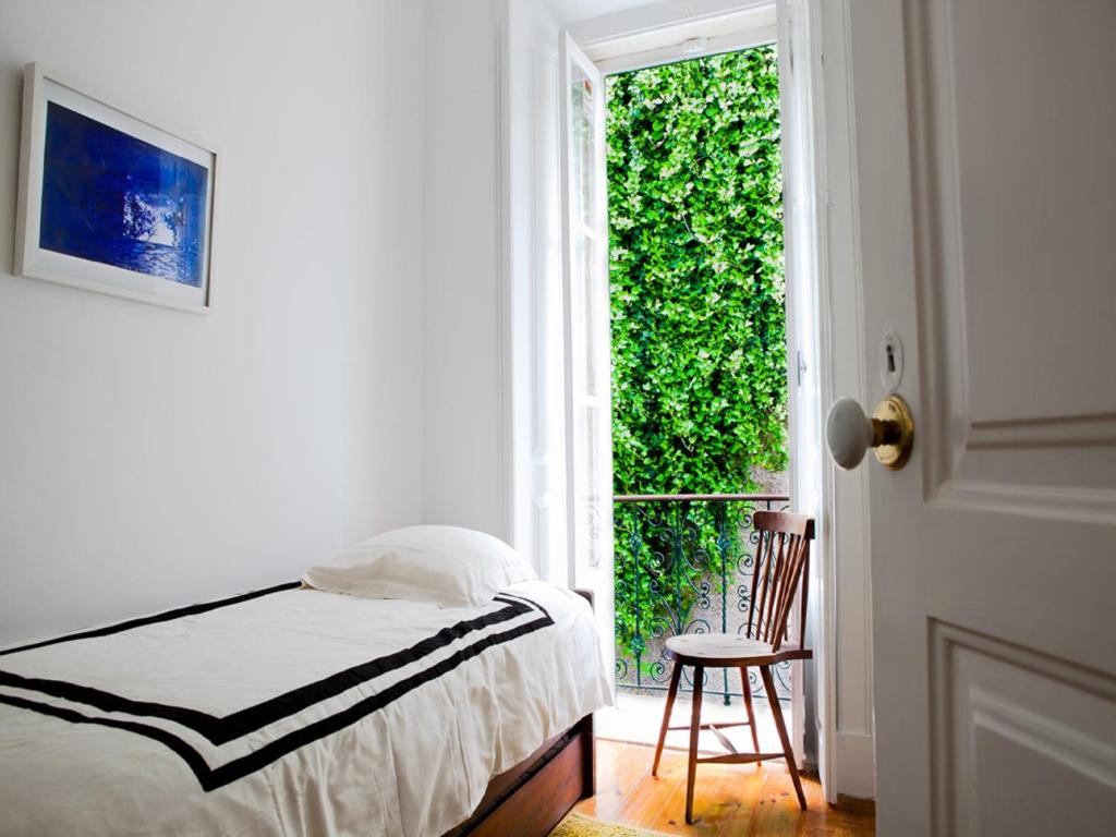 Un pat sau paturi într-o cameră la Myplace - Lisbon Castle