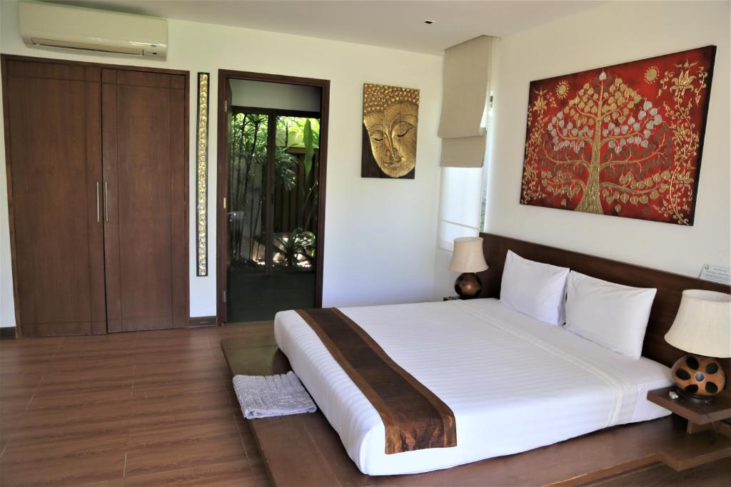 Postel nebo postele na pokoji v ubytování Laguna Villas Boutique Hotel