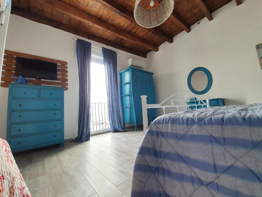 Postel nebo postele na pokoji v ubytování B&B La Terrazza di NonnAnna
