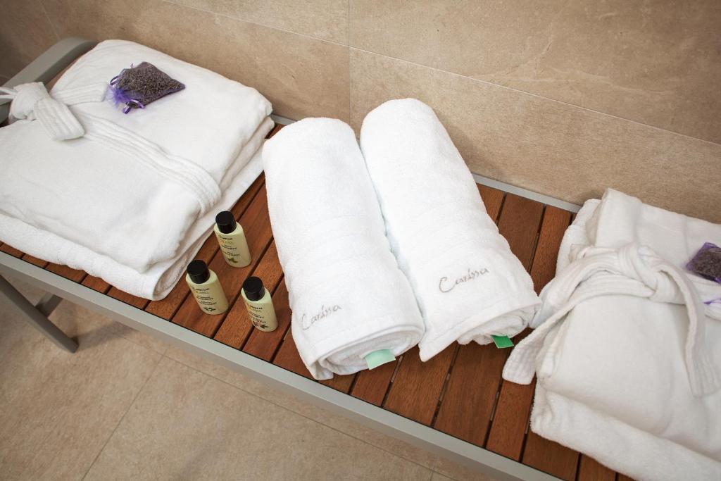 Postel nebo postele na pokoji v ubytování Deluxe Apartments Vila Carissa