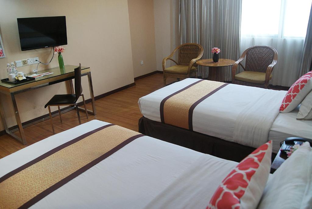 Postel nebo postele na pokoji v ubytování TD Plaza Hotel