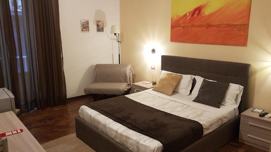 En eller flere senge i et værelse på B&B Napoli Storica
