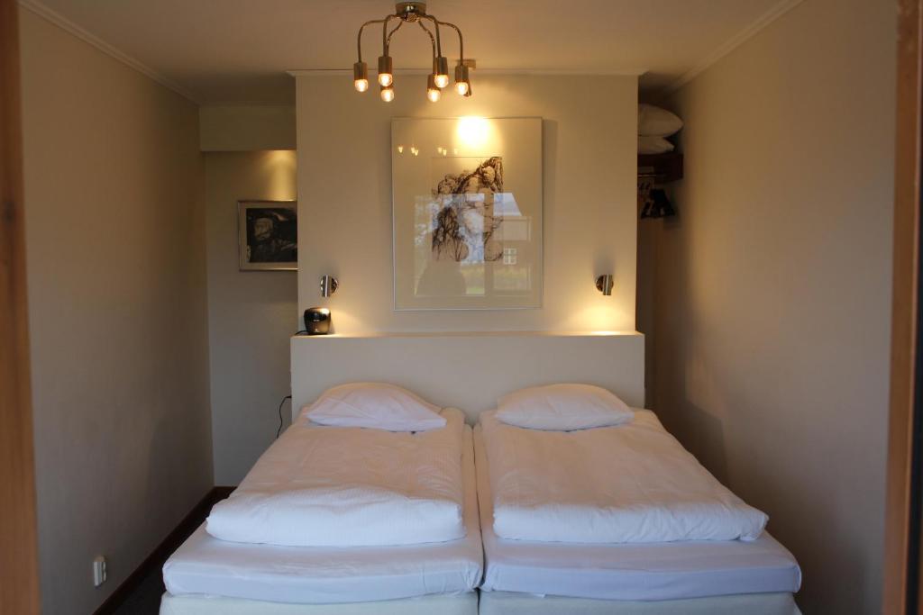 Postel nebo postele na pokoji v ubytování Green Hotel