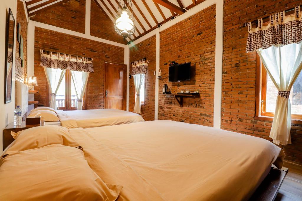 Postel nebo postele na pokoji v ubytování Omah Teras Bata Guesthouse