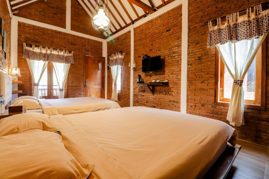 Postel nebo postele na pokoji v ubytování Omah Teras Bata Guesthouse