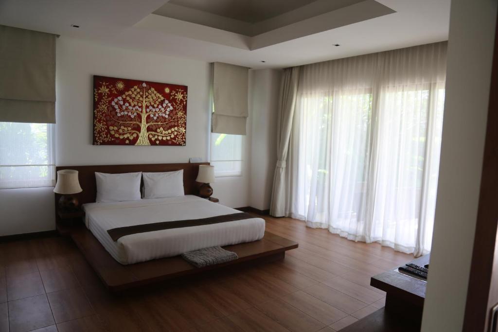 Postel nebo postele na pokoji v ubytování Laguna Villas Boutique Hotel