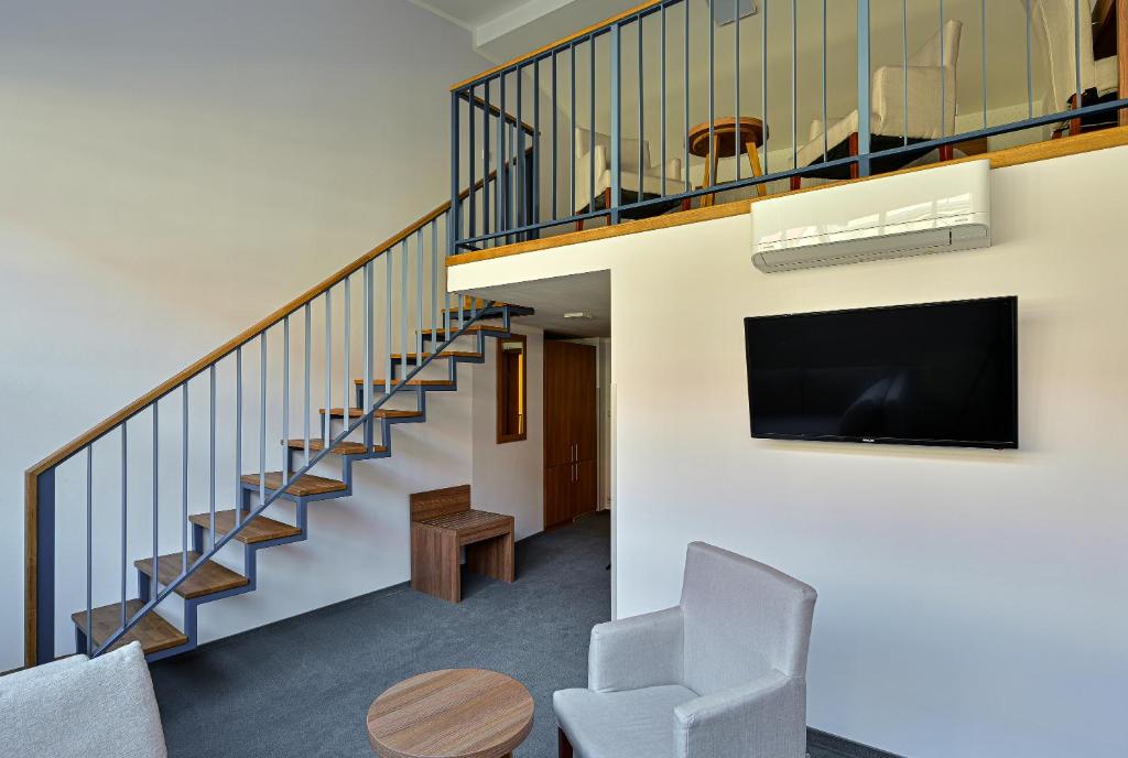 TV a/nebo společenská místnost v ubytování Hotel Prague Star
