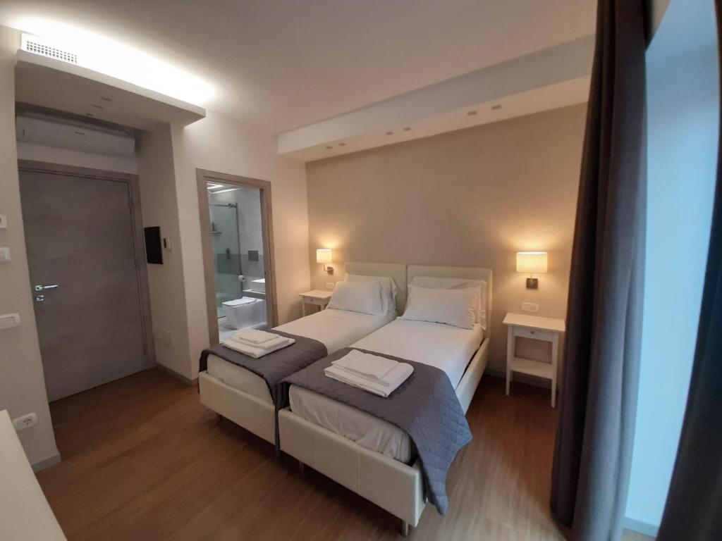 Postel nebo postele na pokoji v ubytování Prestige Rooms Chiaia
