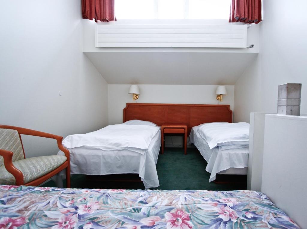 Postel nebo postele na pokoji v ubytování Hotel Orkin