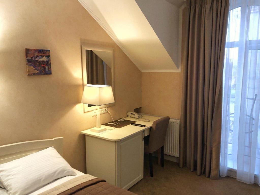 Postel nebo postele na pokoji v ubytování Hotel Ajur