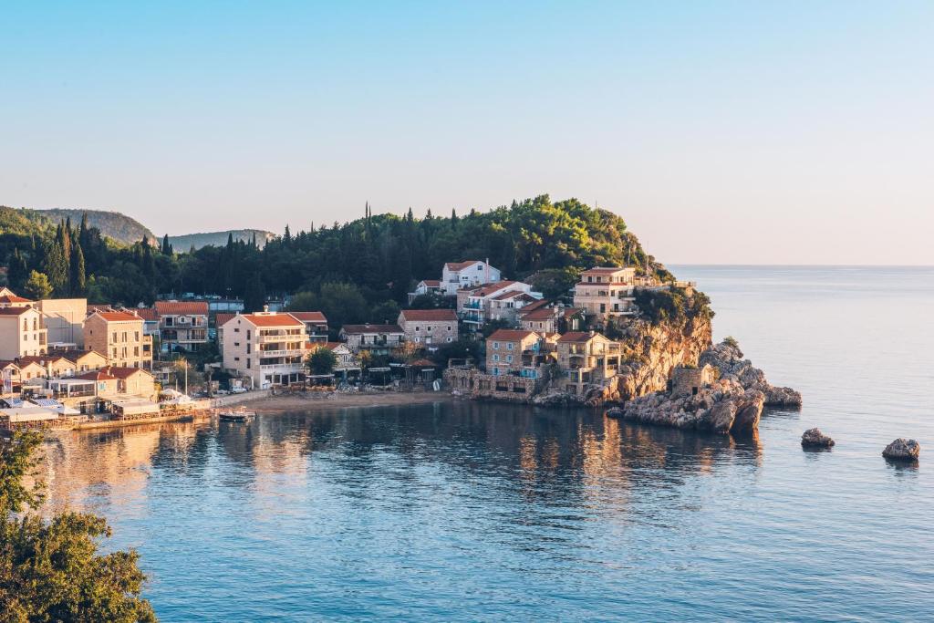a town on the shore of a body of water at Iberostar Waves Slavija in Budva
