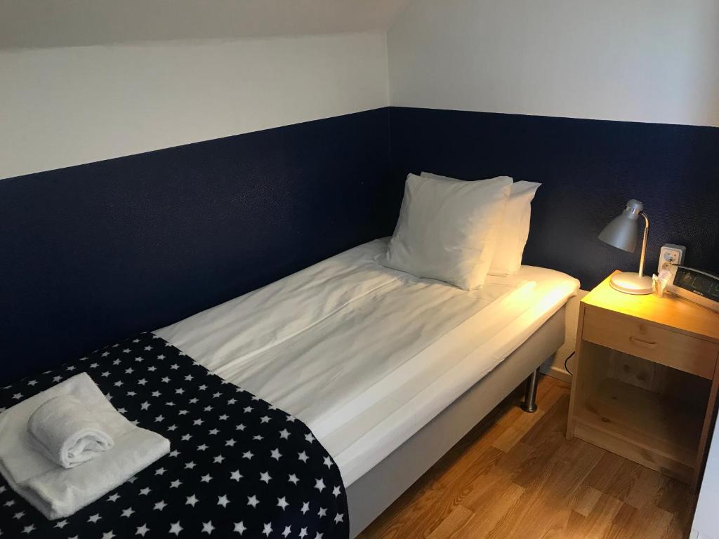 Postel nebo postele na pokoji v ubytování Port Hotel