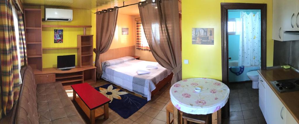 Postel nebo postele na pokoji v ubytování Bungalows Alpha