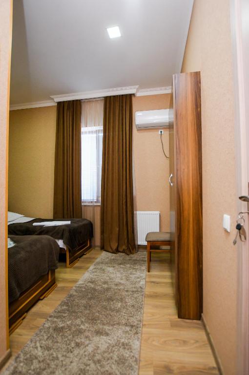 Postel nebo postele na pokoji v ubytování kutaisi Sunrise