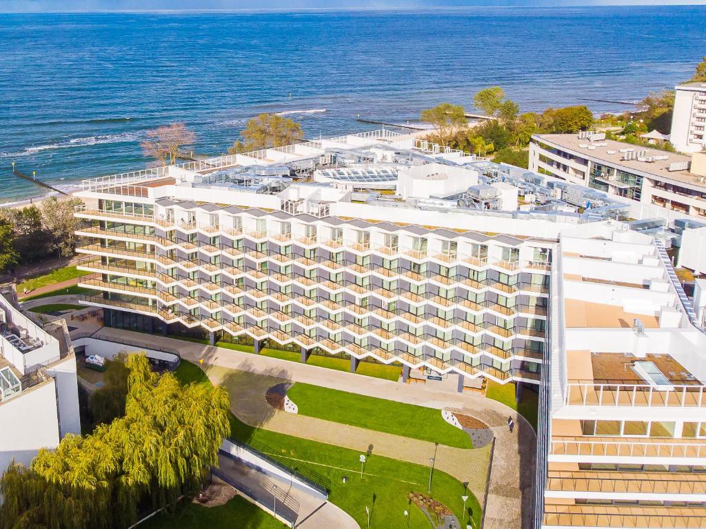 an aerial view of a hotel and the ocean at 3L Apartments Seaside Park in Kołobrzeg