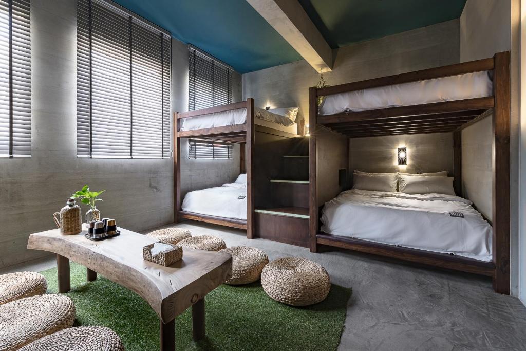 Postel nebo postele na pokoji v ubytování Loft Inn