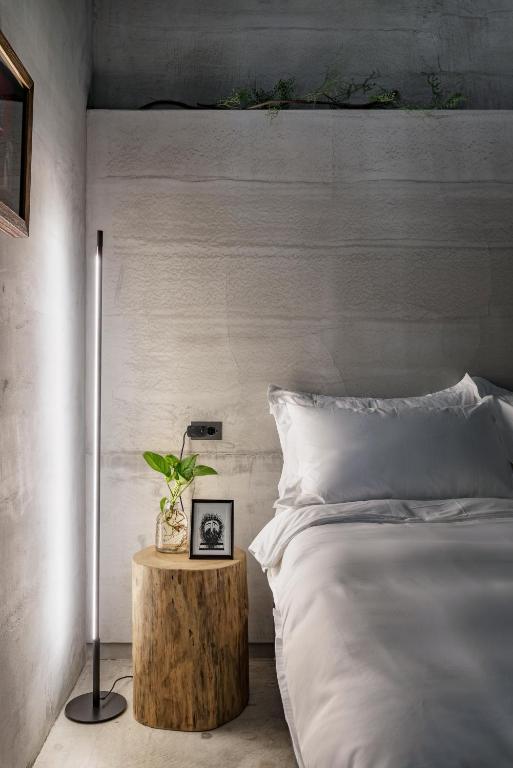 Postel nebo postele na pokoji v ubytování Loft Inn