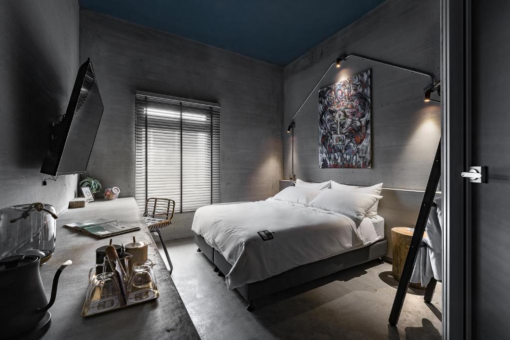 Postel nebo postele na pokoji v ubytování Loft Inn