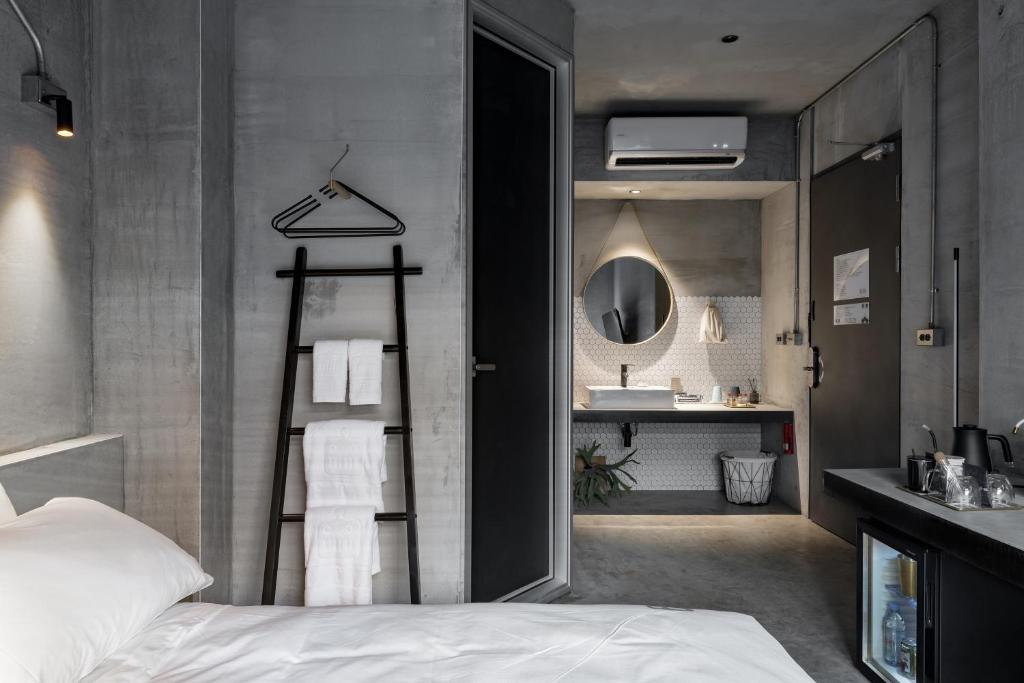 Postel nebo postele na pokoji v ubytování Loft Inn