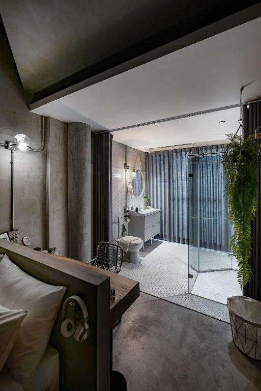 Postel nebo postele na pokoji v ubytování Loft Inn