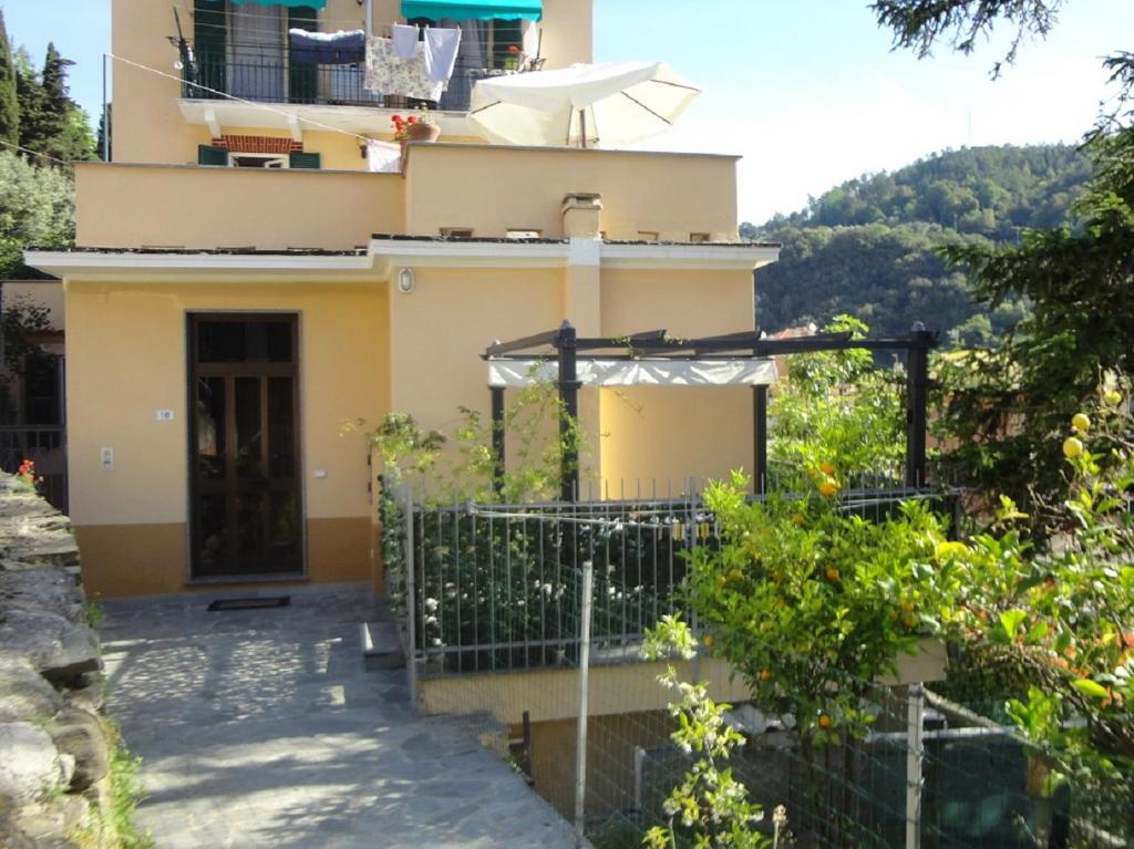 a house with a gate in front of it at Varazze Apartment in Varazze
