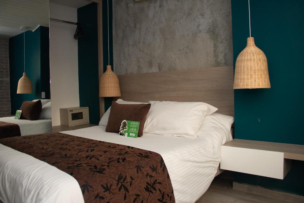 Letto o letti in una camera di Hotel Buena Vista