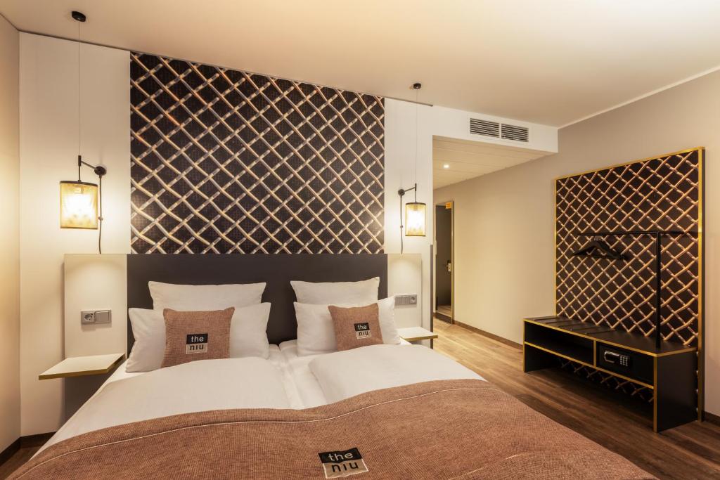 Postel nebo postele na pokoji v ubytování Holiday Inn - the niu, Mesh Stuttgart Messe by IHG