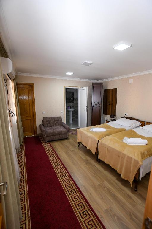 Postel nebo postele na pokoji v ubytování kutaisi Sunrise