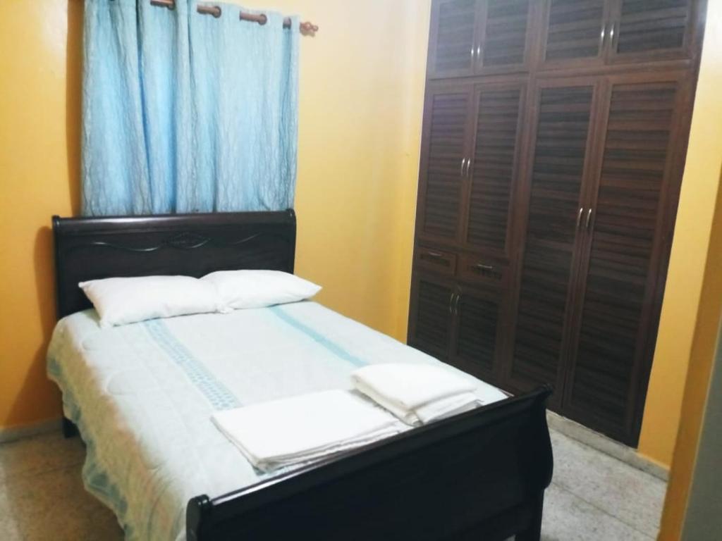 
A bed or beds in a room at Temptation Apartamentos Amueblados.
