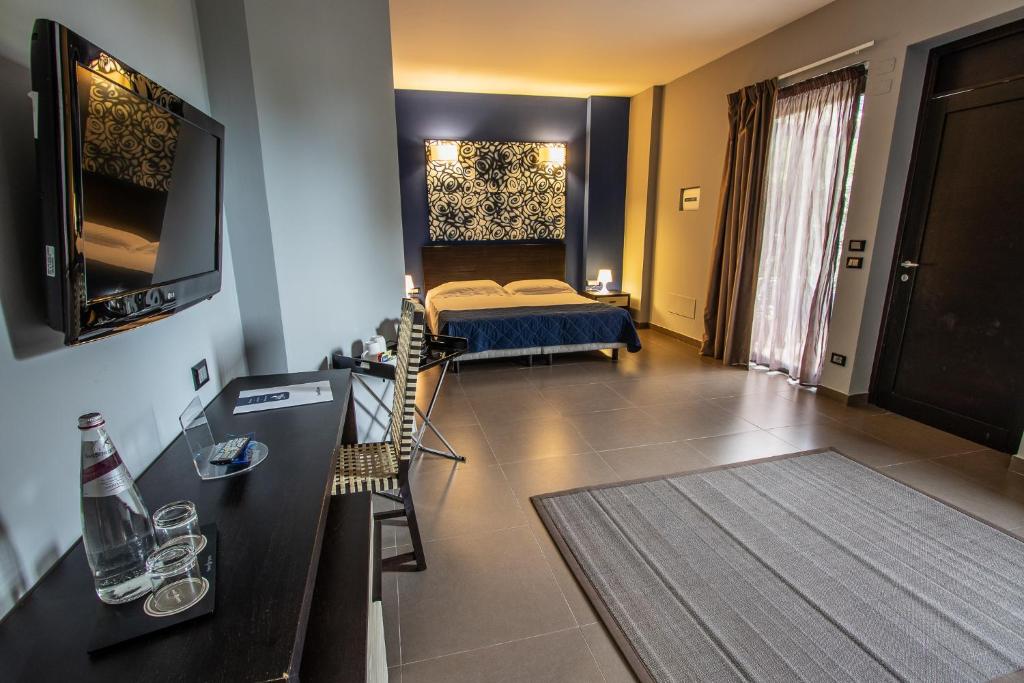 Postel nebo postele na pokoji v ubytování Le Dune Resort