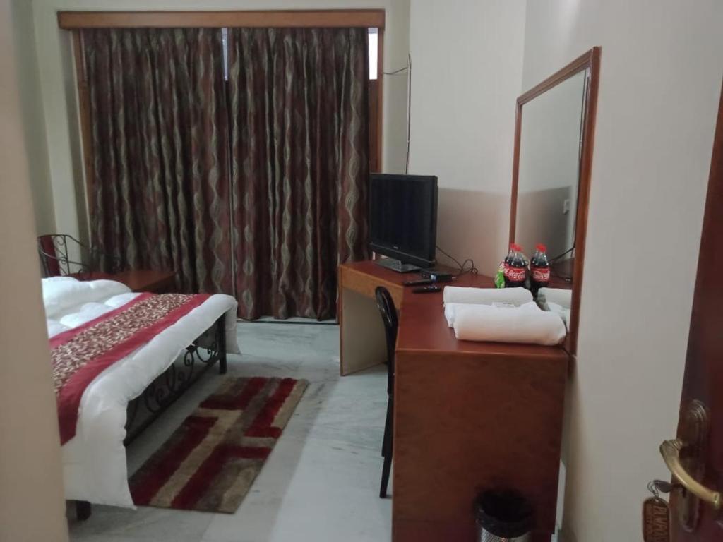 Postel nebo postele na pokoji v ubytování Pamposh Guest House, Gurgaon