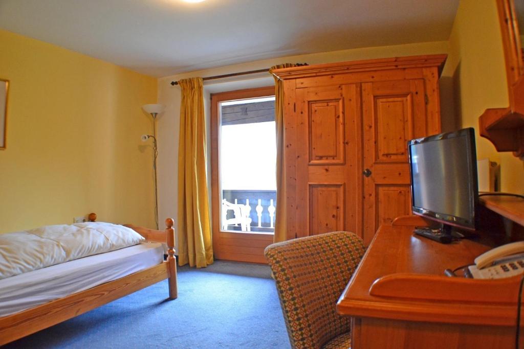 Posteľ alebo postele v izbe v ubytovaní Hotel Mooserkreuz